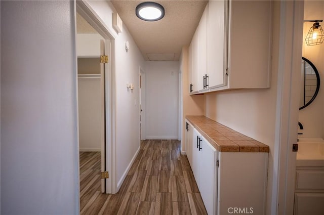 58168 Canterbury St, Yucca Valley, CA 92284 - hall with wood finished floors and a textured ceiling