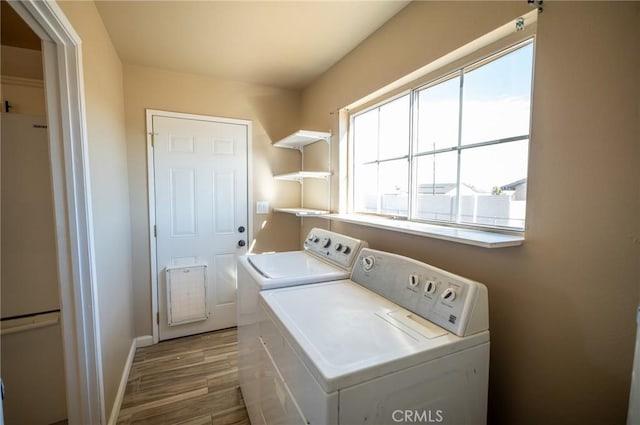 58168 Canterbury St, Yucca Valley, CA 92284 - laundry room with washer and clothes dryer and wood finished floors