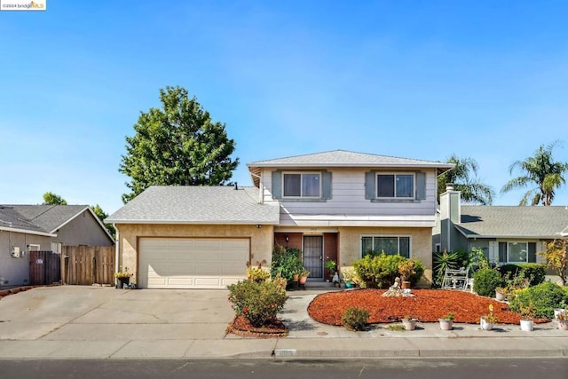 front of property with a garage