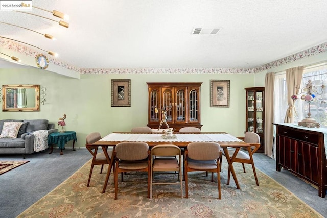 dining space featuring carpet flooring