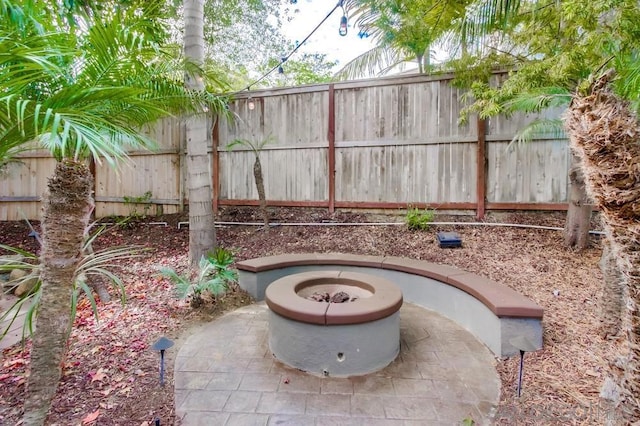 view of patio / terrace featuring a fire pit