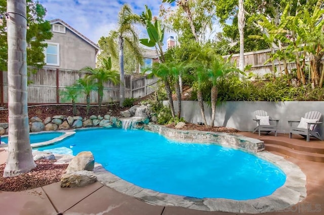 view of swimming pool featuring a wooden deck