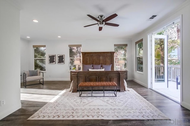 bedroom featuring ceiling fan, dark wood-type flooring, and access to outside