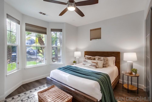 bedroom featuring ceiling fan and dark wood-type flooring