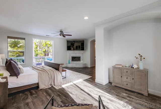 bedroom with ceiling fan and dark wood-type flooring