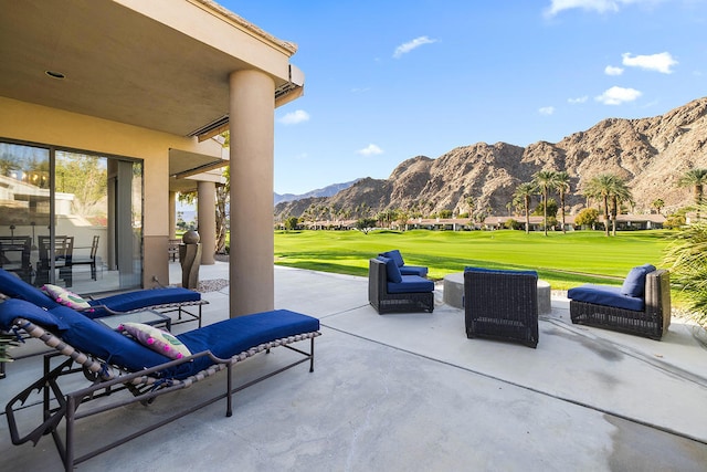 view of patio / terrace featuring a mountain view