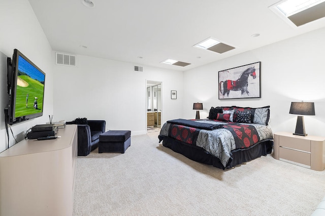 carpeted bedroom featuring ensuite bathroom