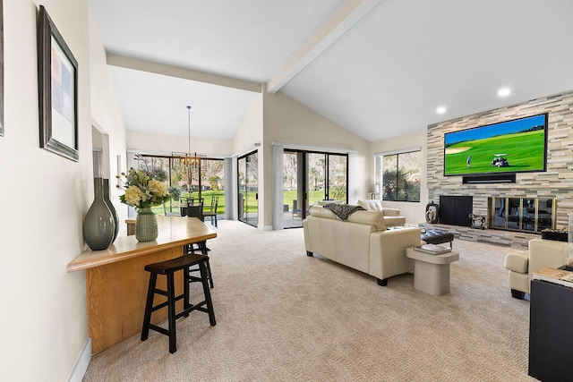 carpeted living room with a notable chandelier, beam ceiling, a stone fireplace, and high vaulted ceiling