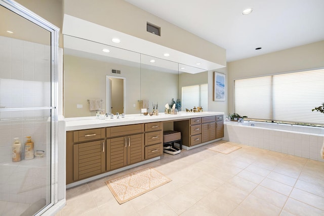 bathroom featuring separate shower and tub, tile patterned floors, and vanity