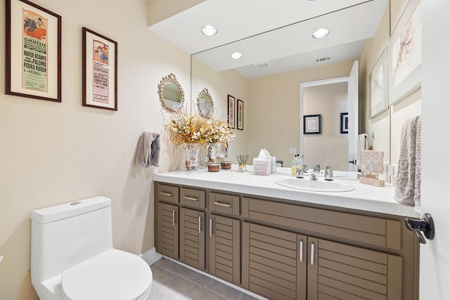 bathroom with tile patterned floors, vanity, and toilet