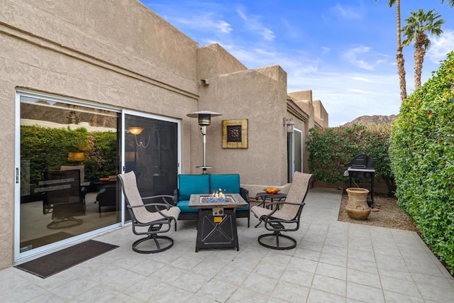 view of patio featuring an outdoor fire pit