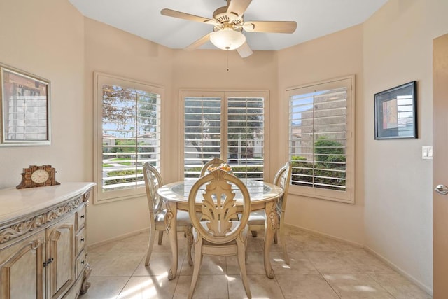 tiled dining room with ceiling fan