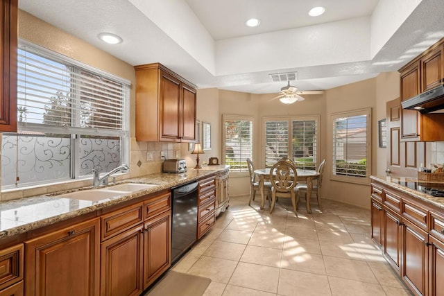 kitchen with backsplash, black appliances, sink, ceiling fan, and light tile patterned flooring