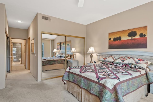 carpeted bedroom with a closet and ceiling fan