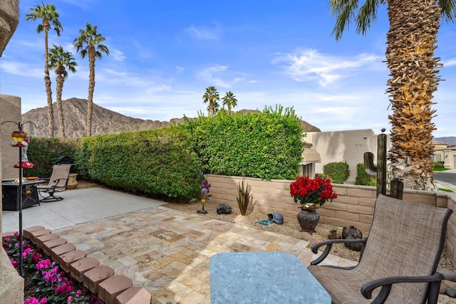 view of patio / terrace with a mountain view