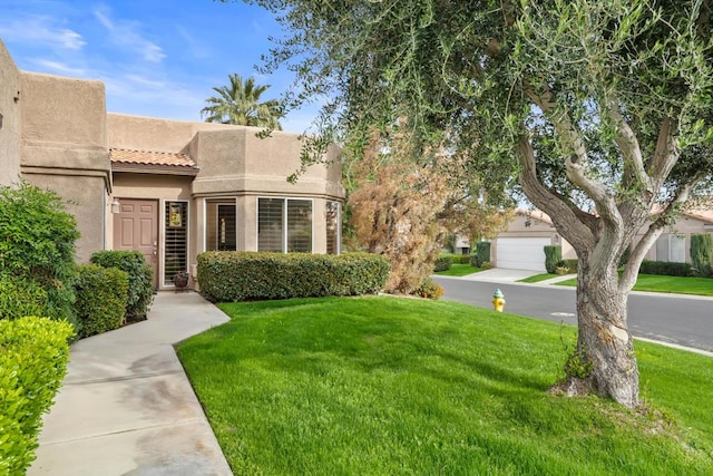 view of front of home with a front lawn