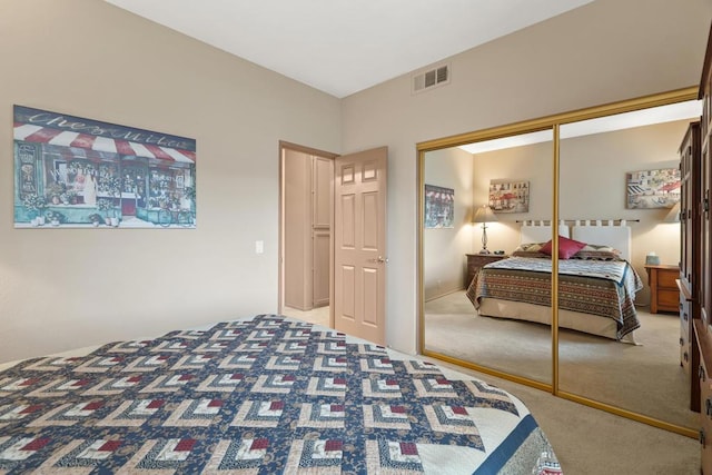 bedroom with carpet and a closet