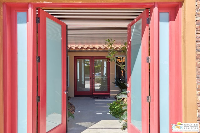 entrance to property featuring french doors