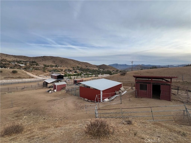 view of mountain feature with a rural view