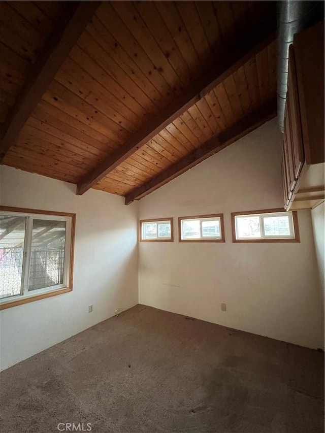 additional living space featuring carpet, vaulted ceiling with beams, and wood ceiling