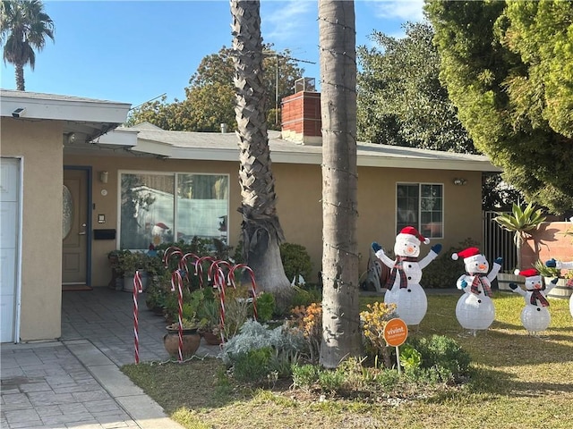 view of side of property featuring a patio