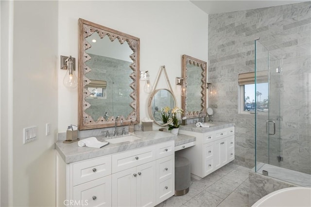 bathroom featuring vanity and an enclosed shower