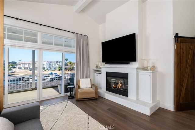 living room featuring beam ceiling, high vaulted ceiling, a brick fireplace, and dark wood-type flooring