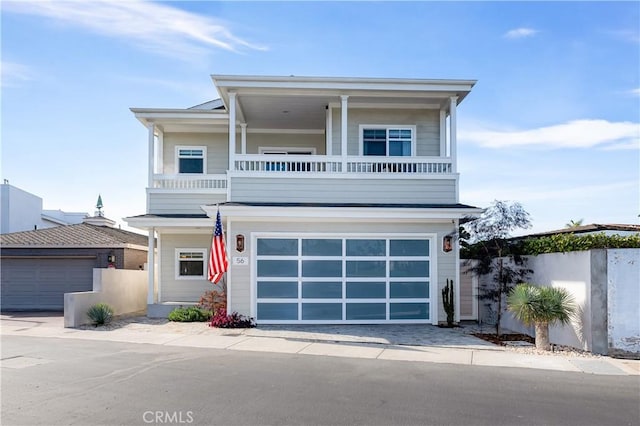 view of front of property with a garage and a balcony