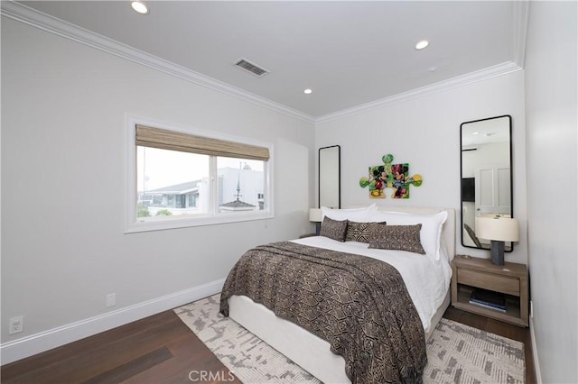 bedroom featuring hardwood / wood-style floors and ornamental molding