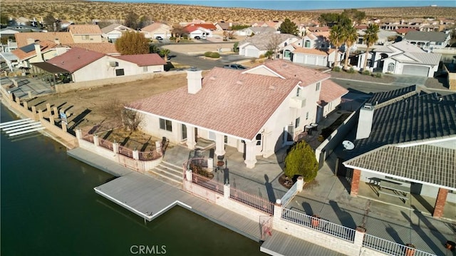 bird's eye view with a water view and a residential view