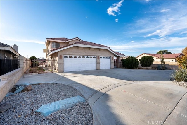 view of front of property featuring fence, driveway, and stucco siding