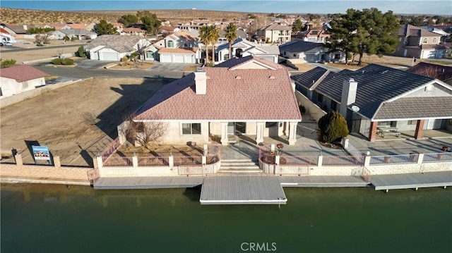 bird's eye view featuring a residential view and a water view