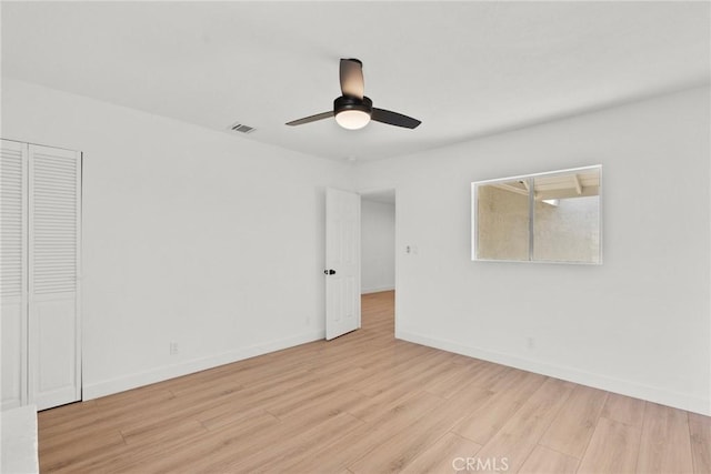 unfurnished room featuring ceiling fan and light hardwood / wood-style floors