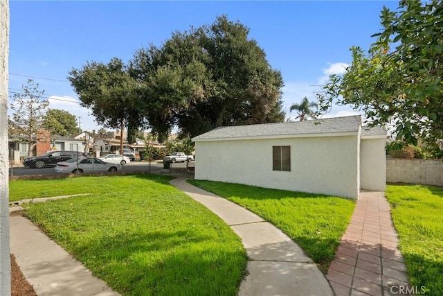 view of side of home featuring a yard