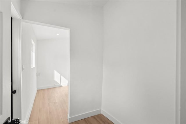 corridor featuring light hardwood / wood-style flooring