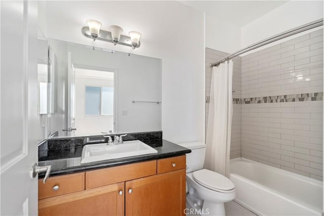 full bathroom featuring vanity, shower / tub combo, and toilet