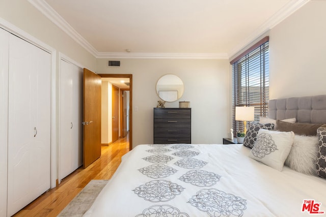 bedroom featuring crown molding and wood-type flooring