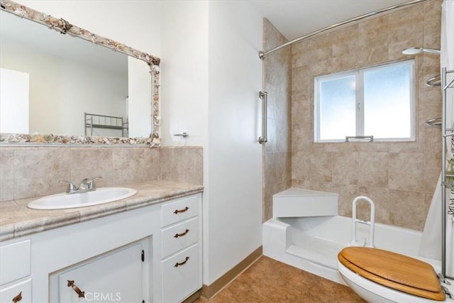 full bathroom with toilet, tile patterned flooring, vanity, and tiled shower / bath