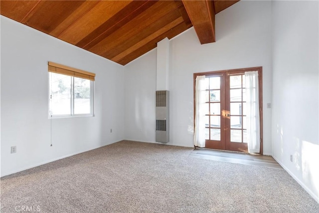 unfurnished living room featuring carpet flooring, plenty of natural light, and french doors