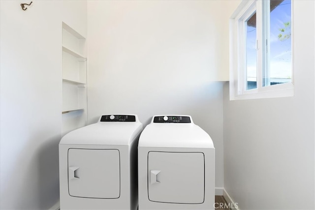 laundry room with washing machine and dryer