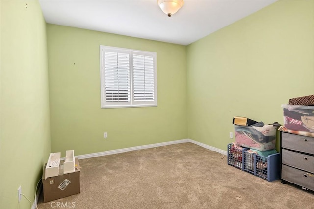 interior space featuring carpet floors and baseboards