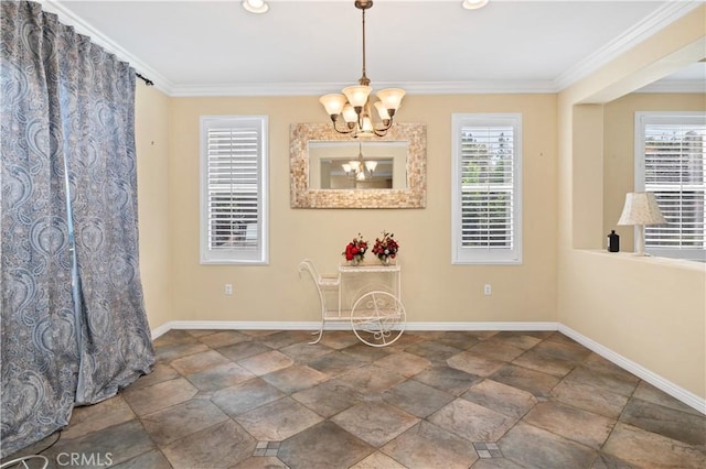 unfurnished dining area featuring crown molding, baseboards, and a notable chandelier