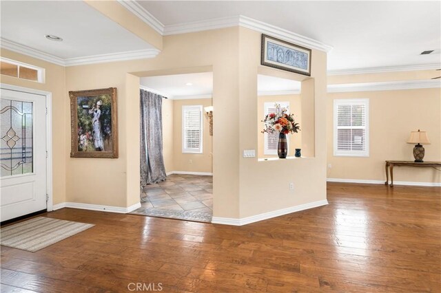 entrance foyer featuring hardwood / wood-style floors and crown molding