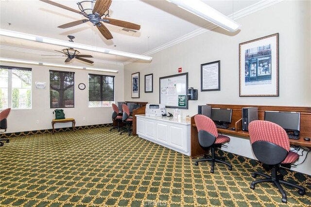 carpeted home office featuring a wealth of natural light, crown molding, and ceiling fan