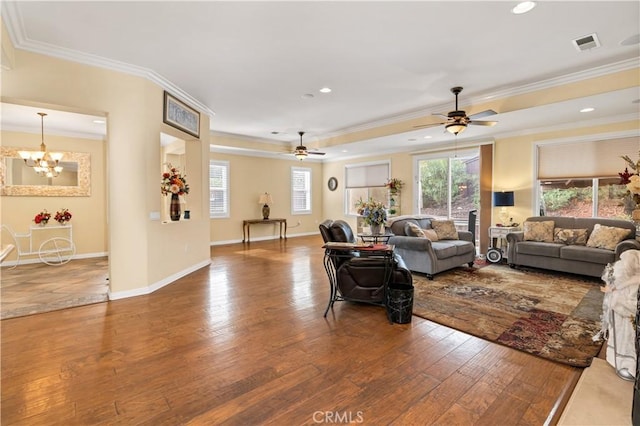 living area with recessed lighting, visible vents, ornamental molding, baseboards, and hardwood / wood-style flooring