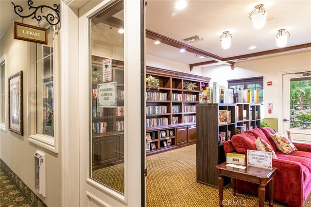 sitting room featuring carpet floors