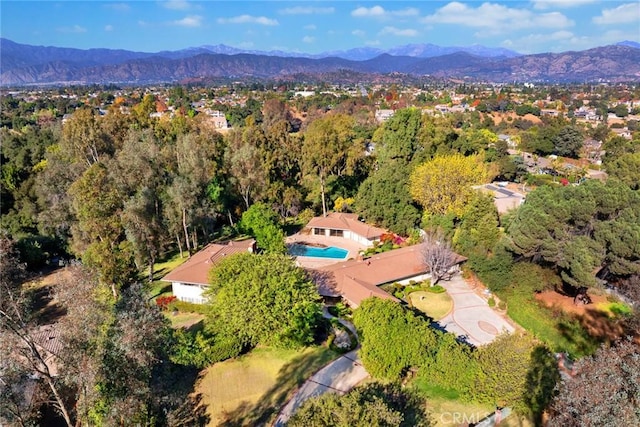 birds eye view of property with a mountain view