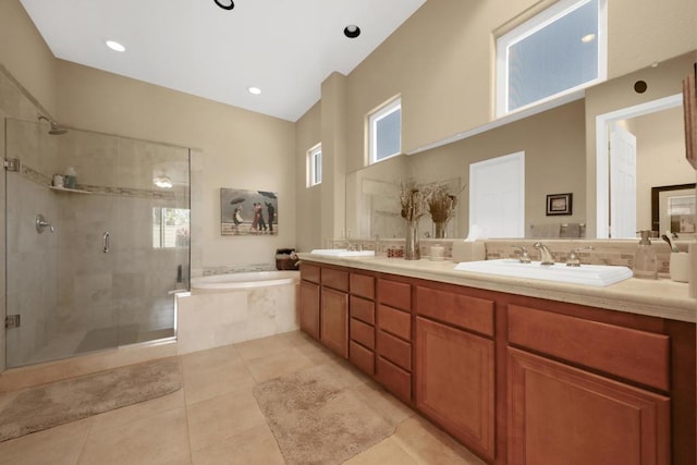 bathroom with vanity, tile patterned floors, and plus walk in shower