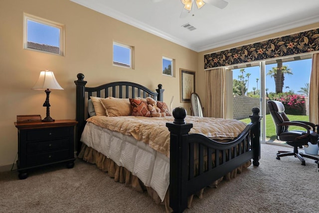 bedroom featuring multiple windows, ornamental molding, carpet flooring, and access to exterior