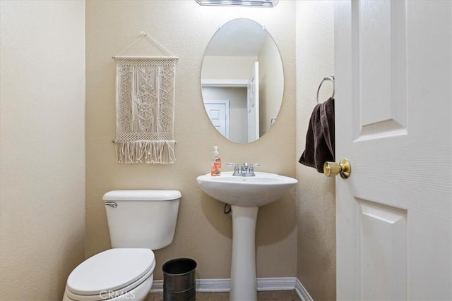 bathroom with toilet and sink